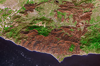 False color Terra satellite image shows burn scars from Woolsey Fire.