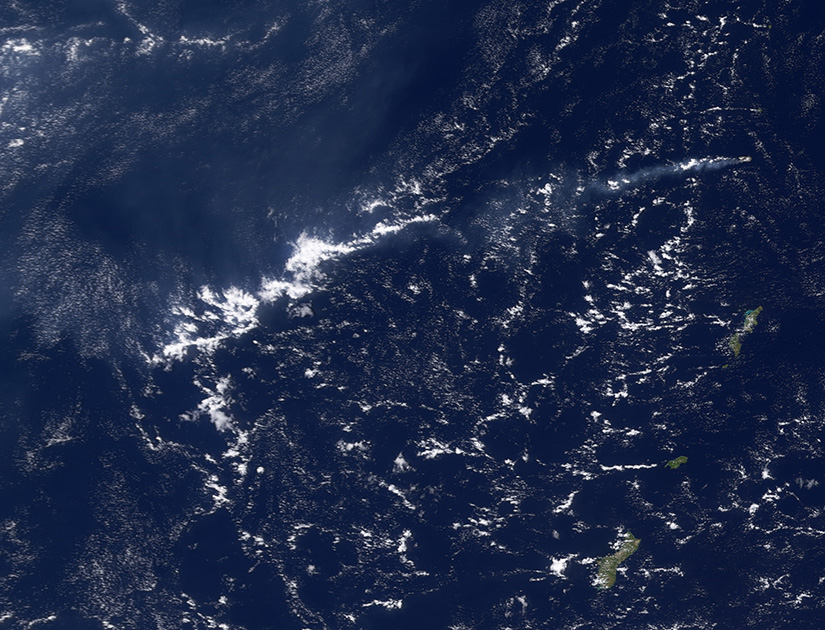 Am image showing clouds that formed through haze (from space).