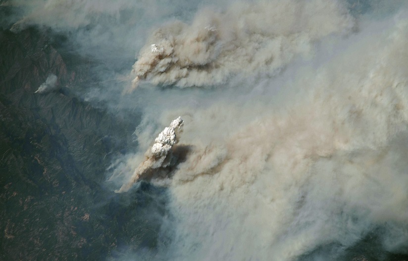 A view of smoke and clouds from space.