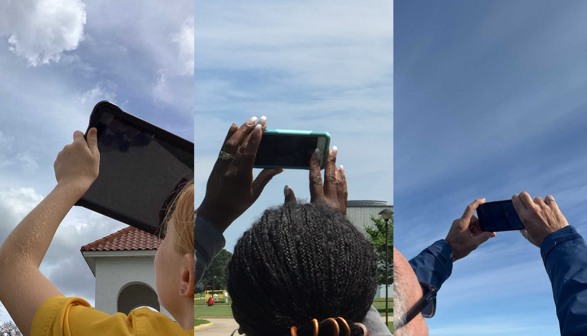 Three volunteer observers point their devices at the sky to collect data with the GLOBE Observer app.