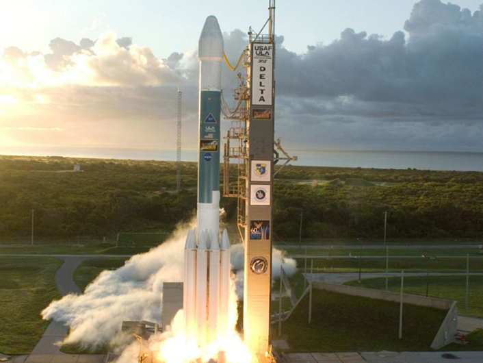 An image show a rocket on a launch pad.  