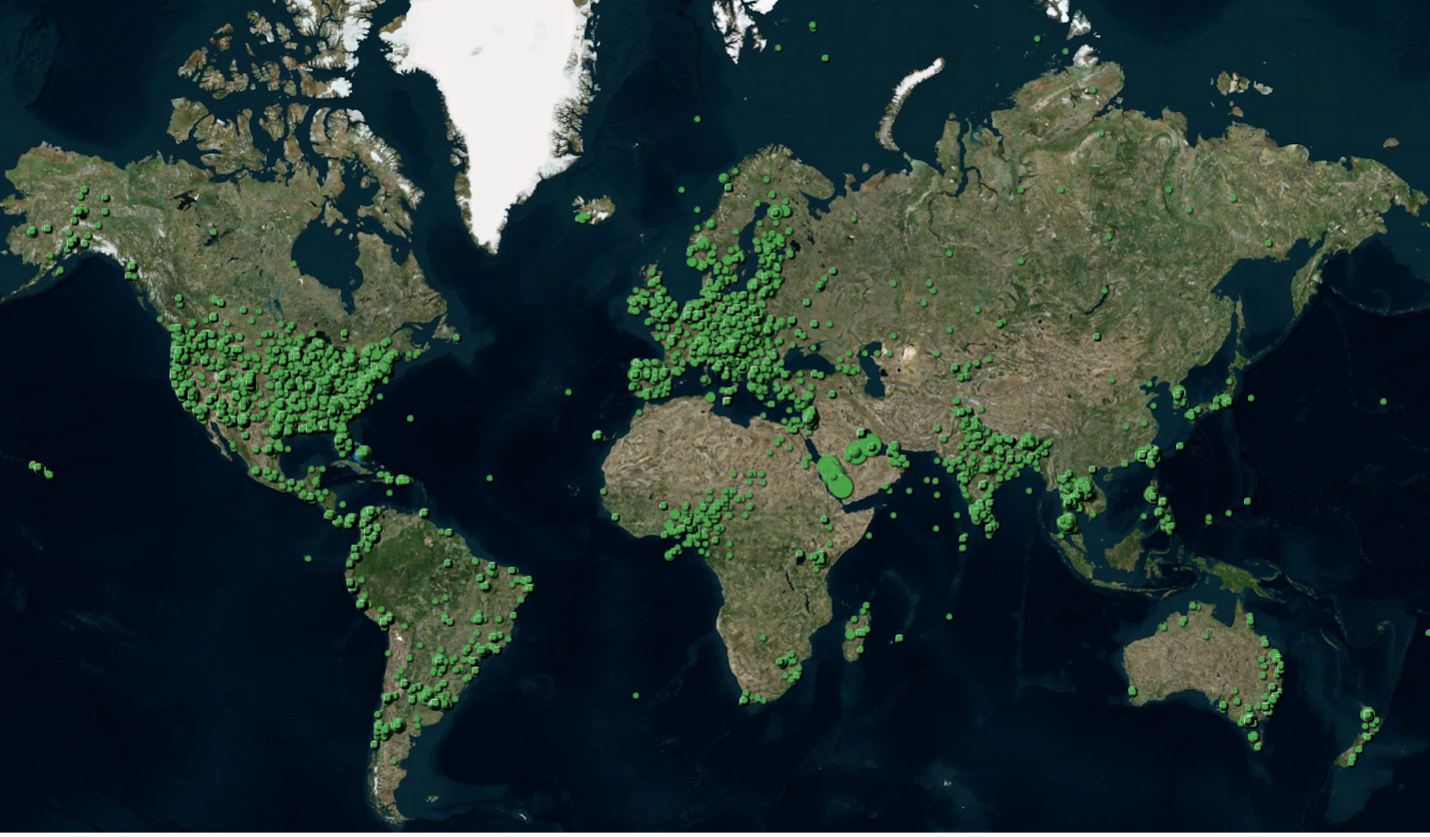 A world map with green dots where tree height measurements have been taken.