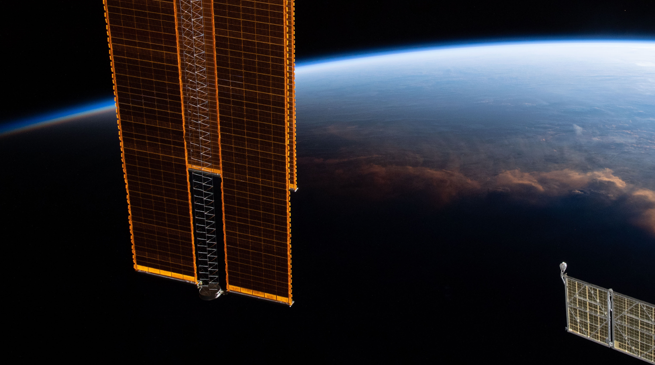 Satellite and view of solar terminator from space