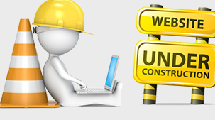 A figure sits with a lap top with construction hat, cone and sign.