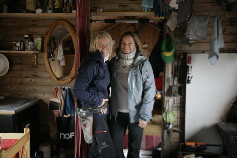 Hilde Fålun Strøm (left) and Sunniva Sorby (right) inside the trapper cabin ‘Bamsebu’ in Svalbard, Norway.